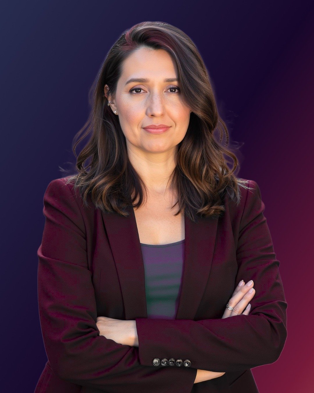 Ale Barav headshot, arms crossed, in a burgundy blazer